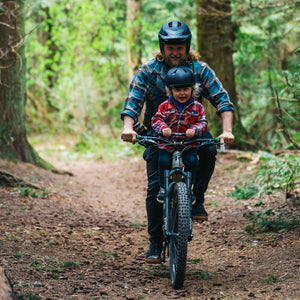 Shotgun Child Bike Handlebars Riding On Trail With Parent